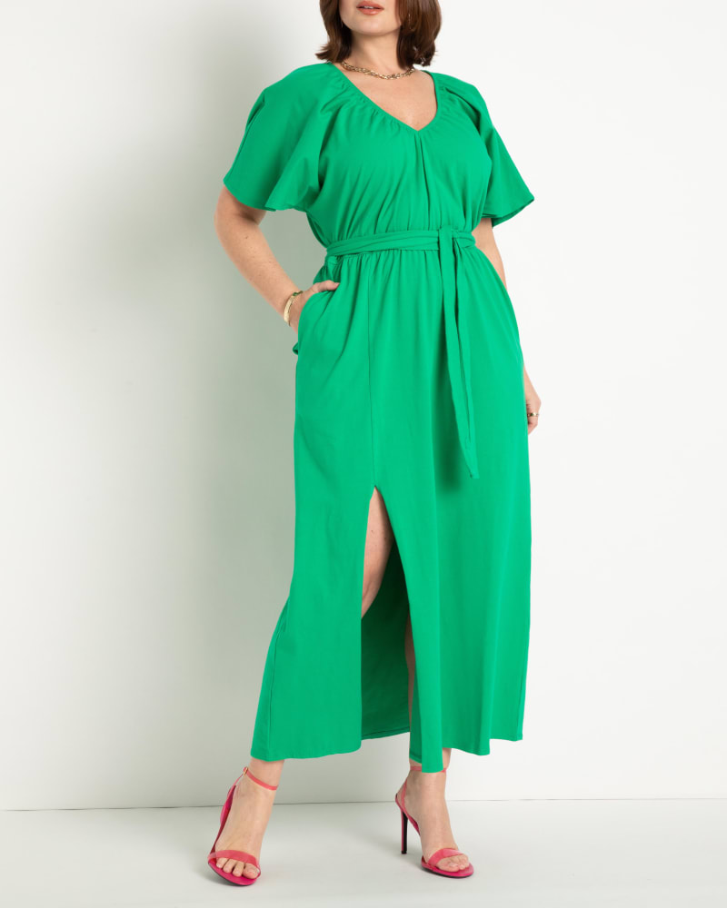 Front of a model wearing a size 18 Knit Maxi Dress With Slit- Bright Green in Bright Green by ELOQUII. | dia_product_style_image_id:283693